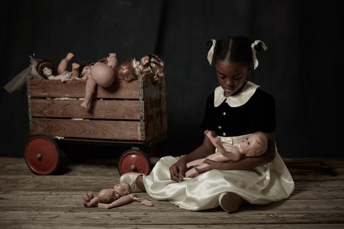 Girl playing with the dolls