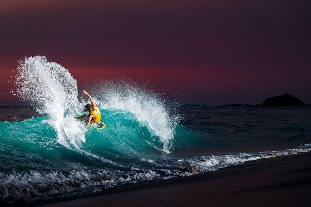surfer surfing in sunset