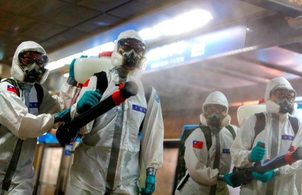 Daniel Shou Yi Ceng medical workers disinfecting contaminated areas durind covid