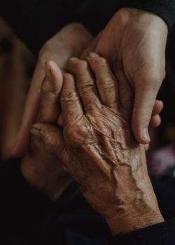 Alina Ostapenko grandchild holding their grandmother's hand