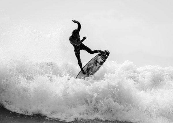 black&white photo of a surfer